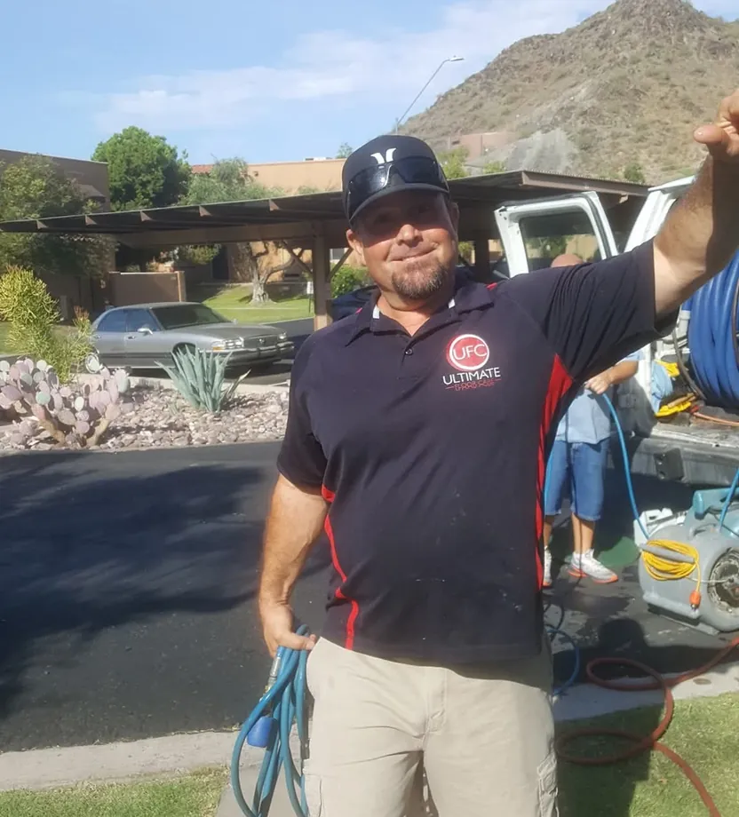 JJ Overfield, Owner / Operator of Ultimate Floor Care, on a job with his van and hose reel