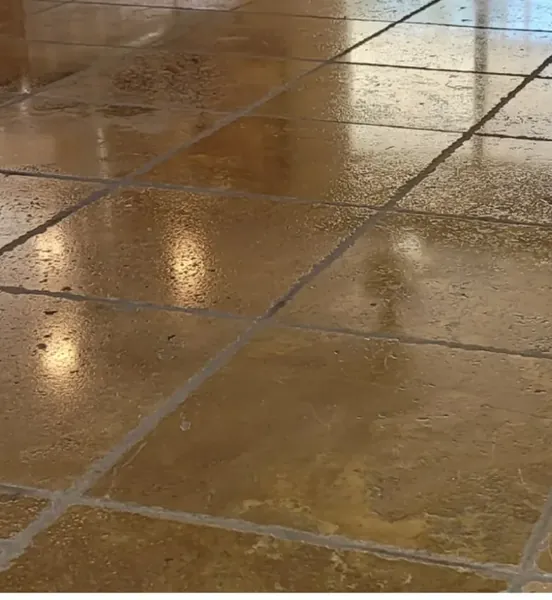 The same travertine floor after cleaning and sealing