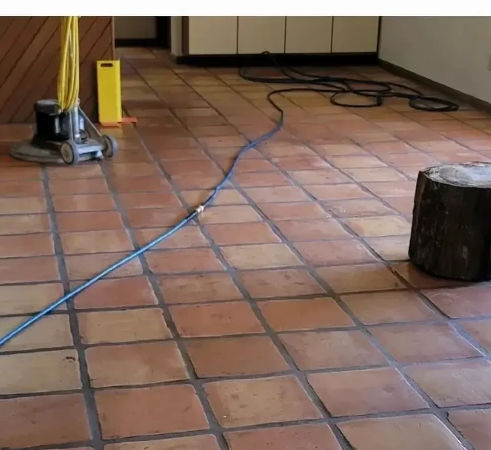 Stone floor showing etching and wear before restoration