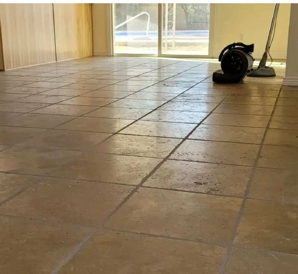 Hard-water etching on a travertine floor in a Phoenix home