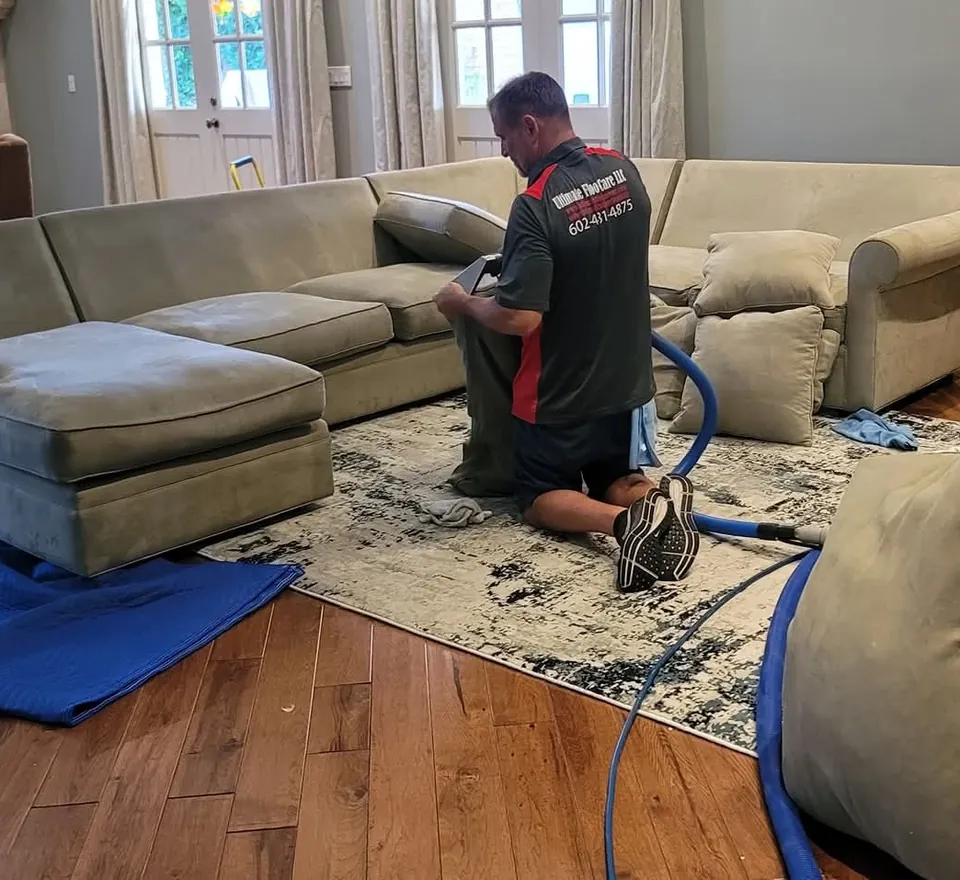 Sofa arm showing wear and soiling before cleaning