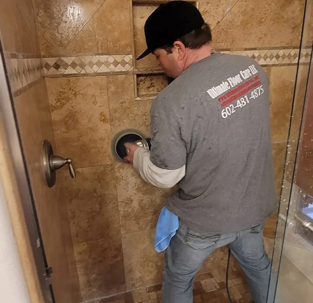 Diamond grinding a stone floor during restoration